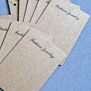 Бирка с вырубкой для серег, картон бежевый, 100x65x0.5 мм